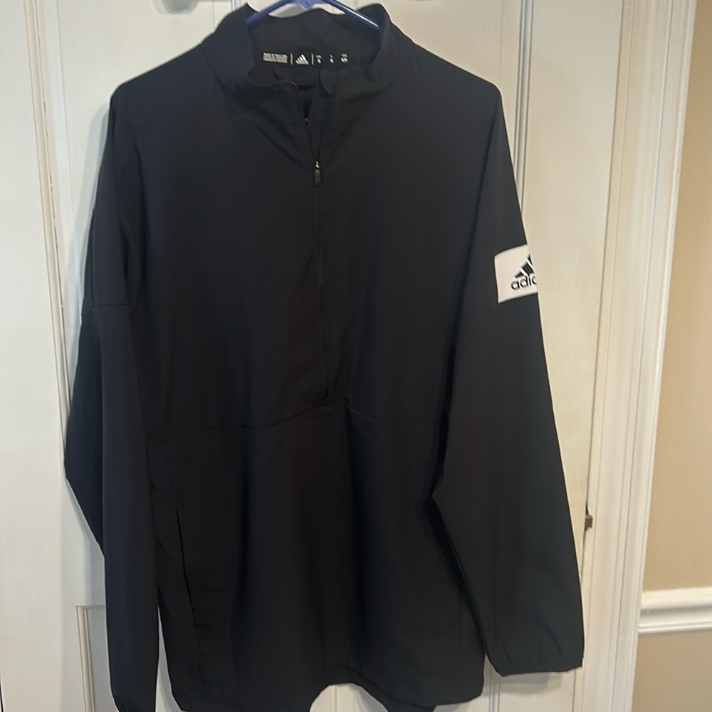 Long sleeve Black Adidas light weight jacket.